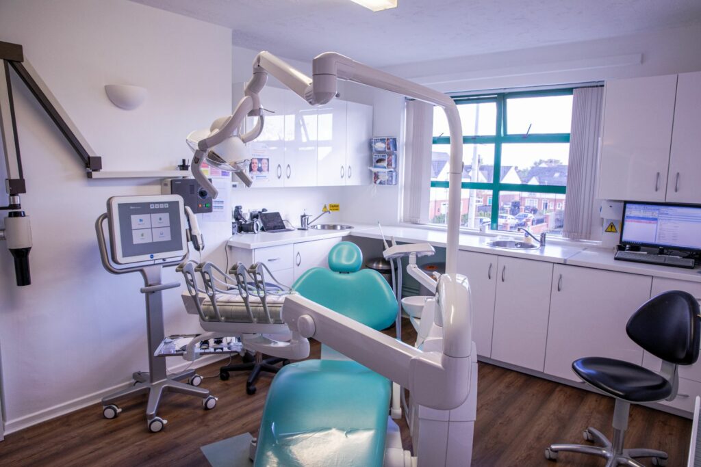 Modern dental treatment room with chair and equipment
