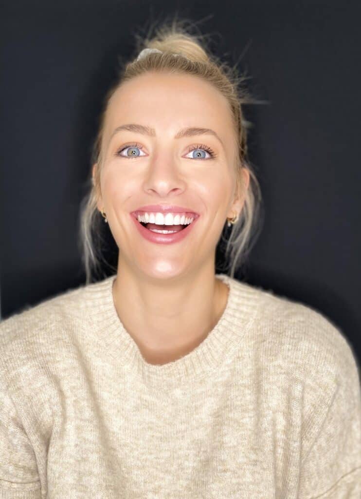 Woman smiling confidently after composite bonding treatment